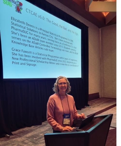 Elizabeth Dennis with presentation screen